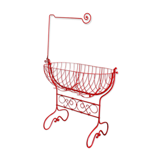 Baby cradle in red wrought iron