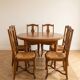 Ensemble table ronde et 6 chaises paillées en bois massif