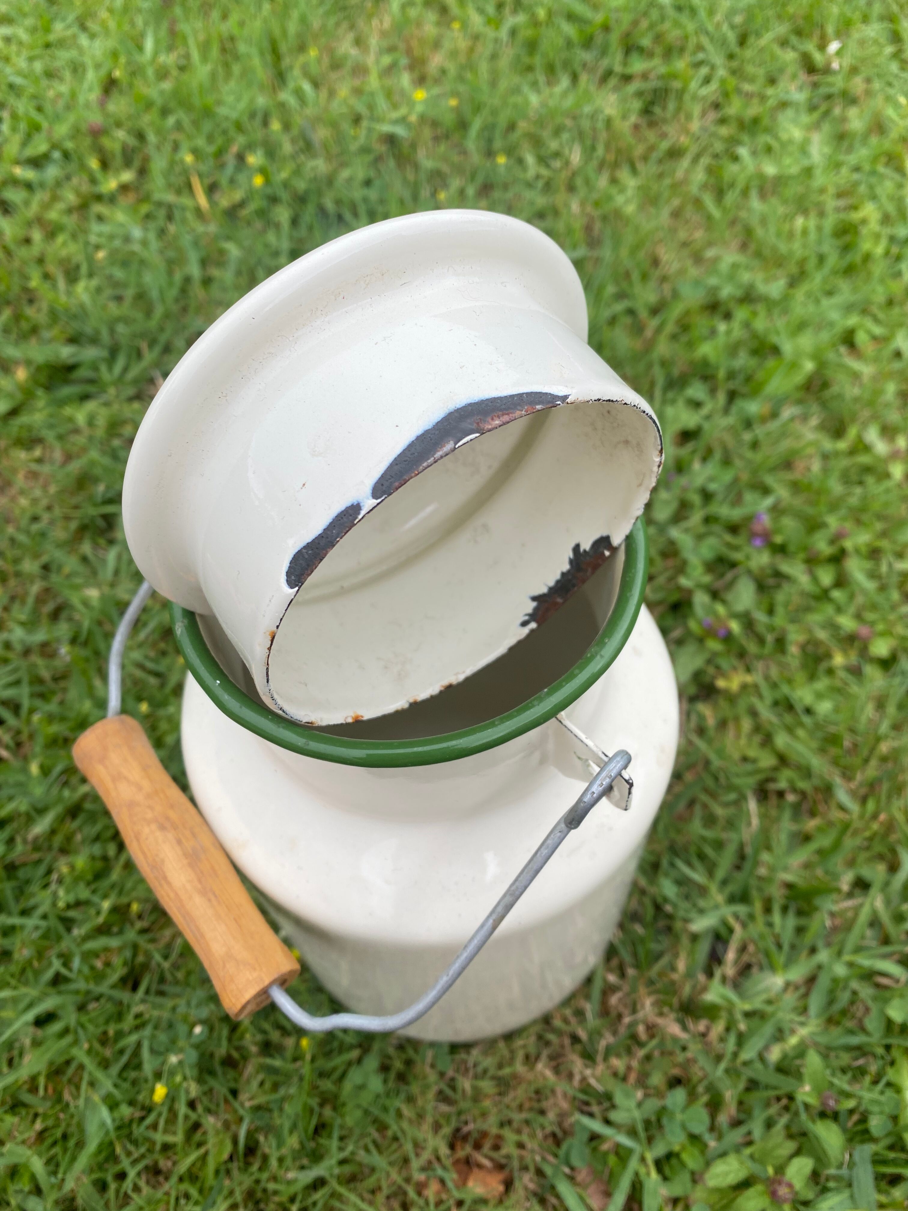 Enamelled old milk pot