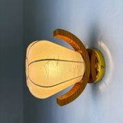 Pair of pear-shaped "Cocoon" wall sconces, resin and pine wood, Italy, 1970s