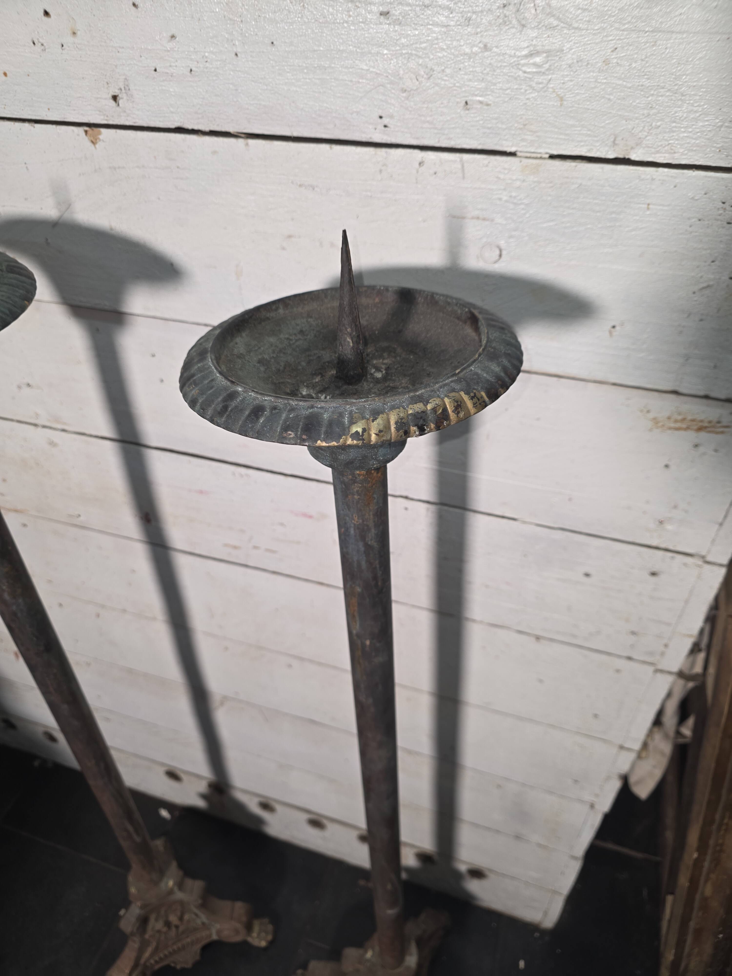 Pair of antique candlesticks, 110cm in height.
