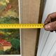 Colorful landscape painting with a river and hills signed Benjam