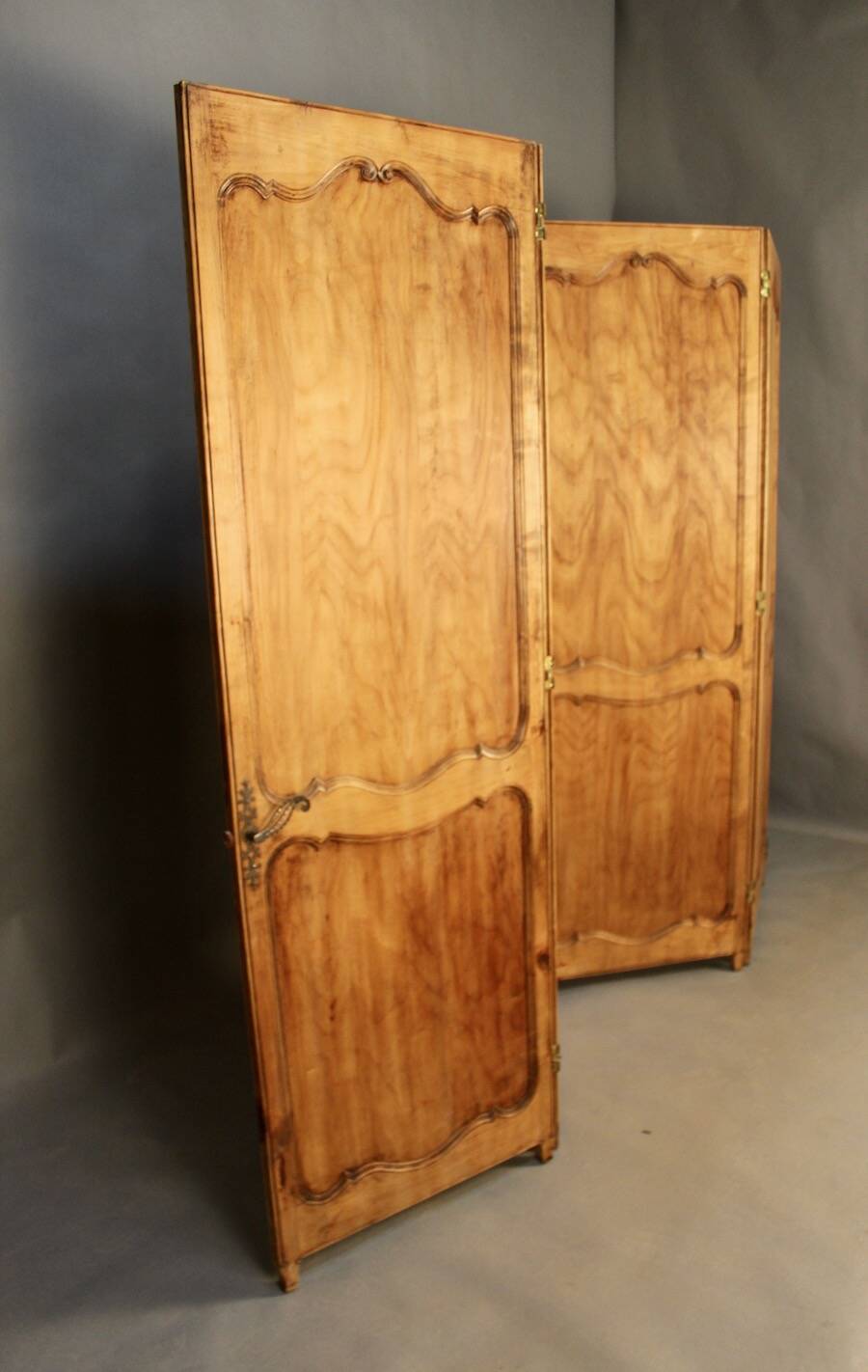 Large cherry wood folding screen with four double-sided panels.