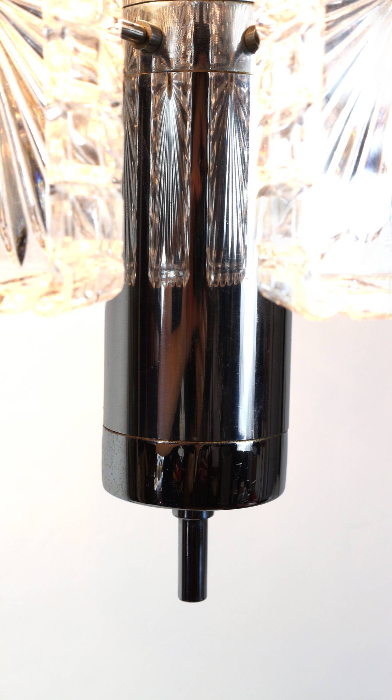 Vintage metal chandelier and carved glass