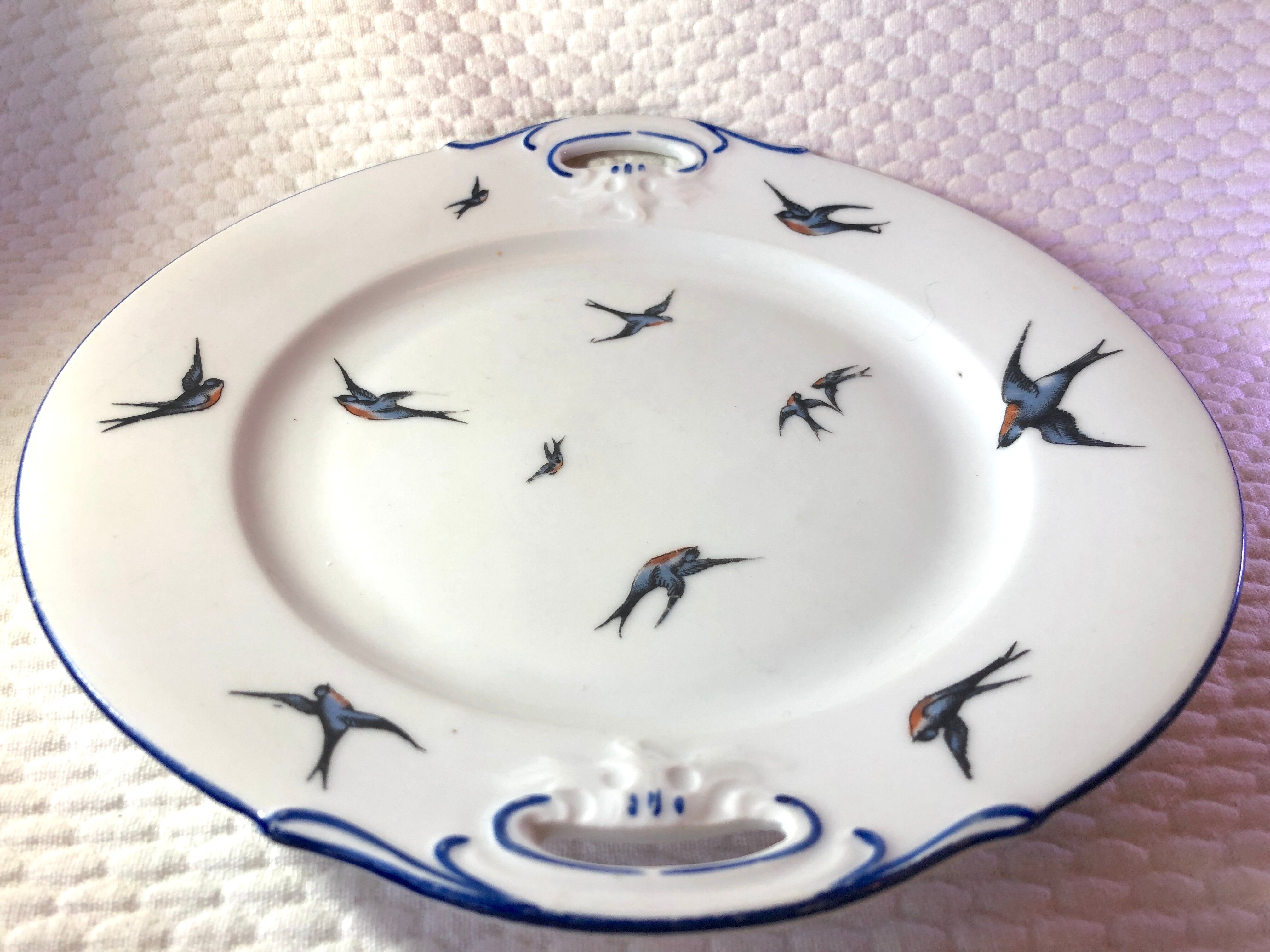 Cake plate decorated blue swallows