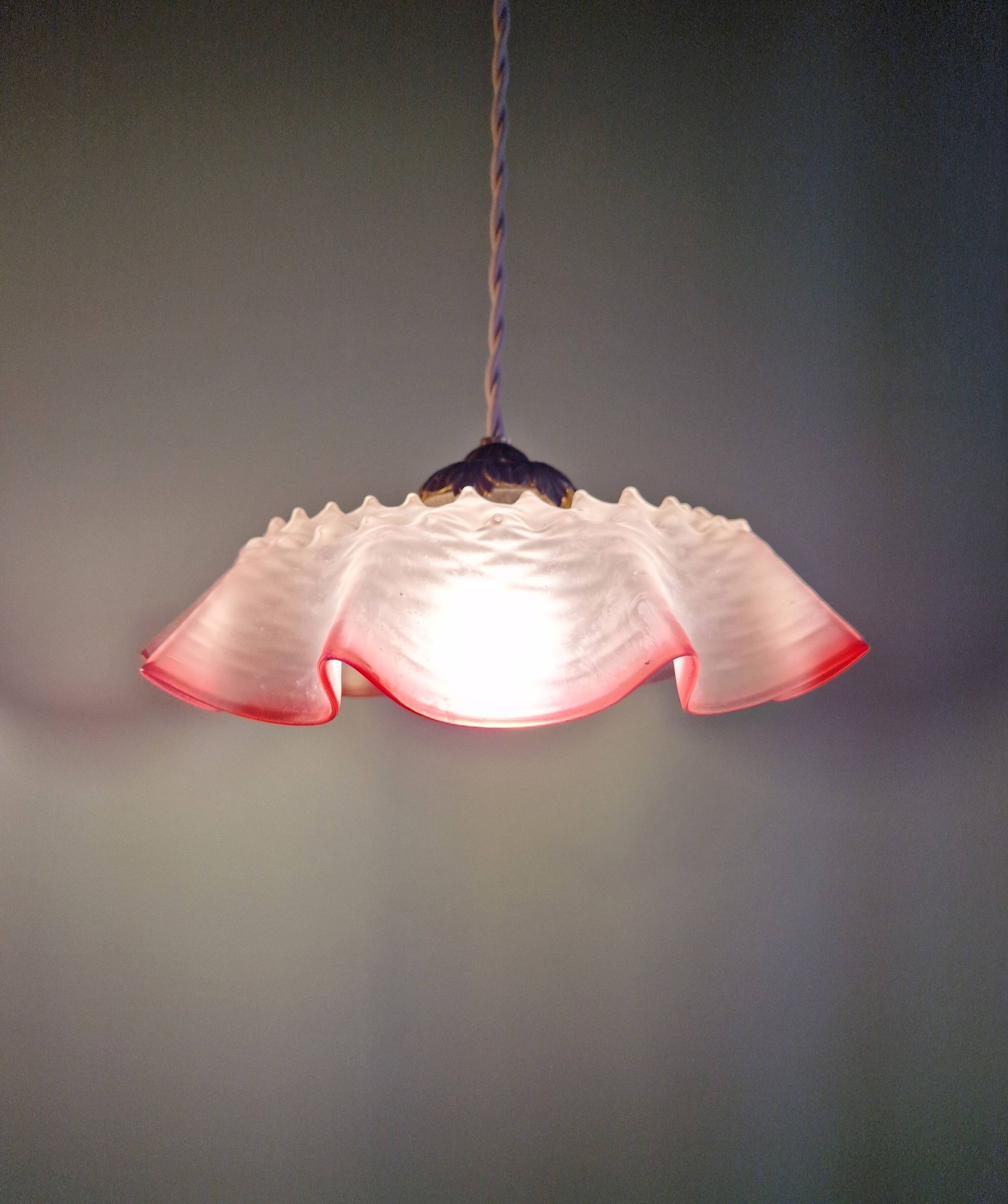 Pair of clear and pink satin glass scalloped pendant lights, 1920s-30s