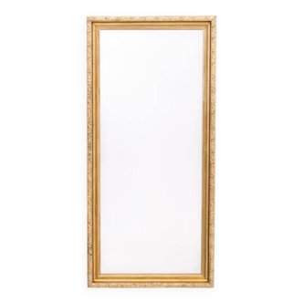 Mirror in a gold frame.