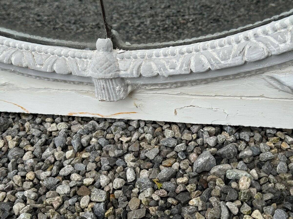 Louis XVI style fireplace mirror, carved wood trumeau with white and grey highlights, 18th century