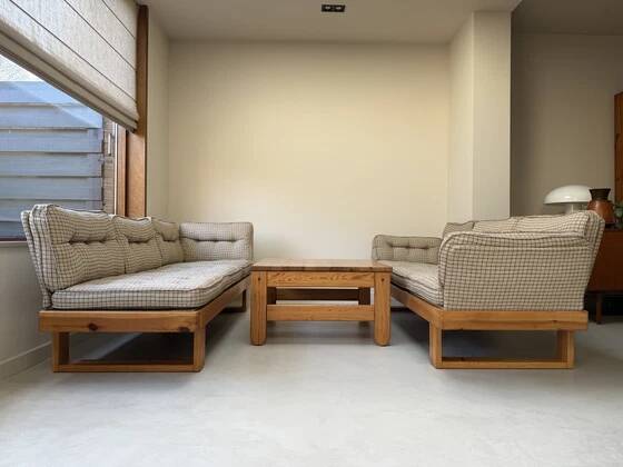 Two vintage Swedish sofas and a pine table