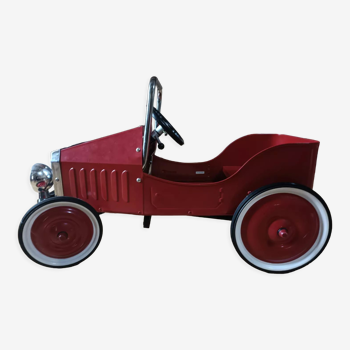 Vintage red pedal car
