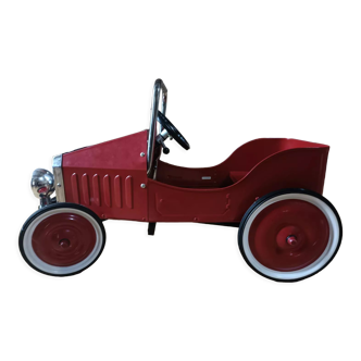 Vintage red pedal car