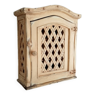 Old medicine cabinet in carved wood
