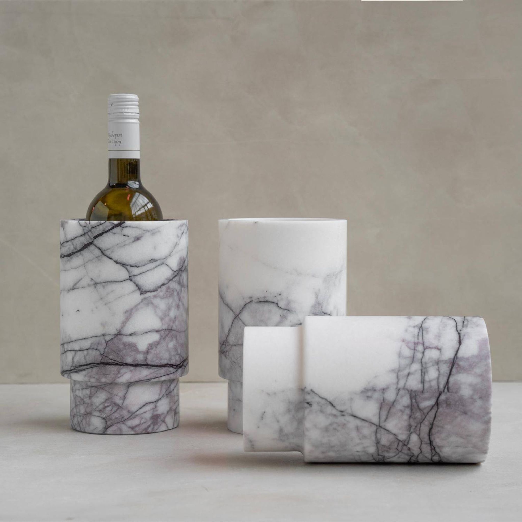 Vase and wine cooler in lilac white marble
