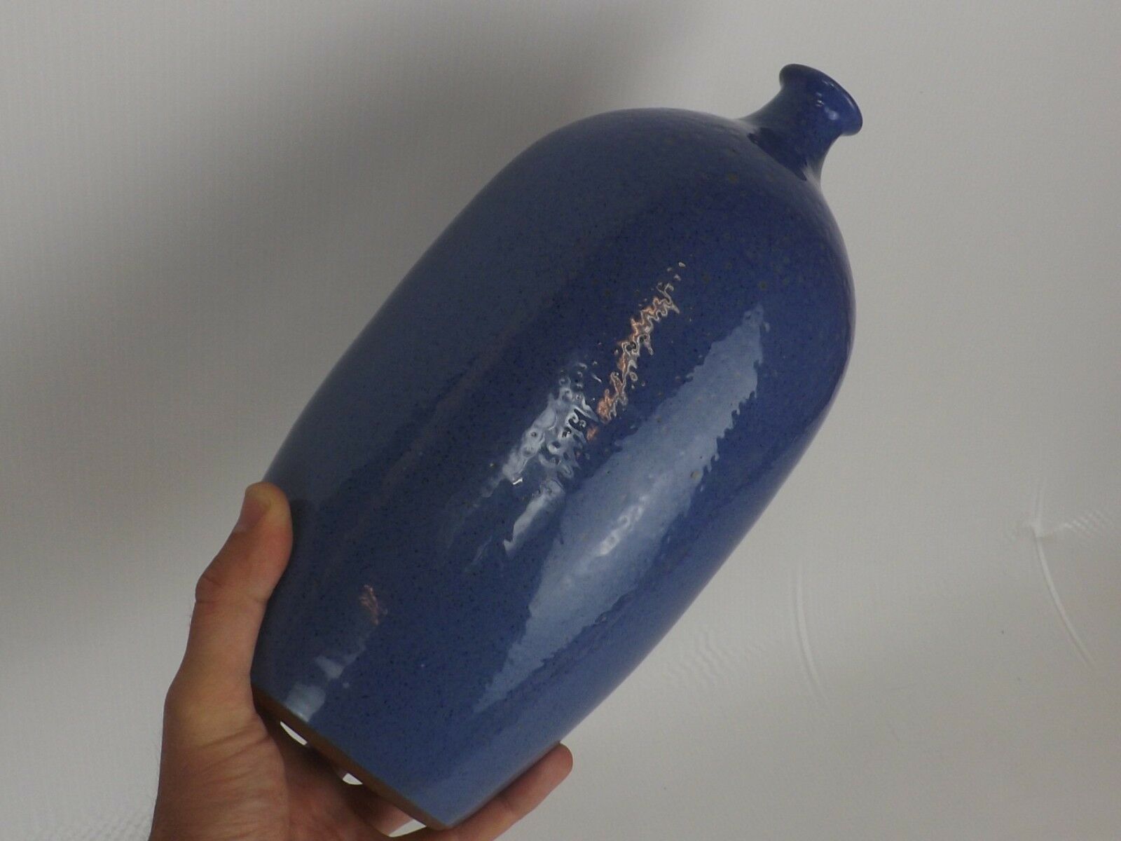 Signed enamelled terracotta bottle vase