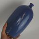Signed enamelled terracotta bottle vase
