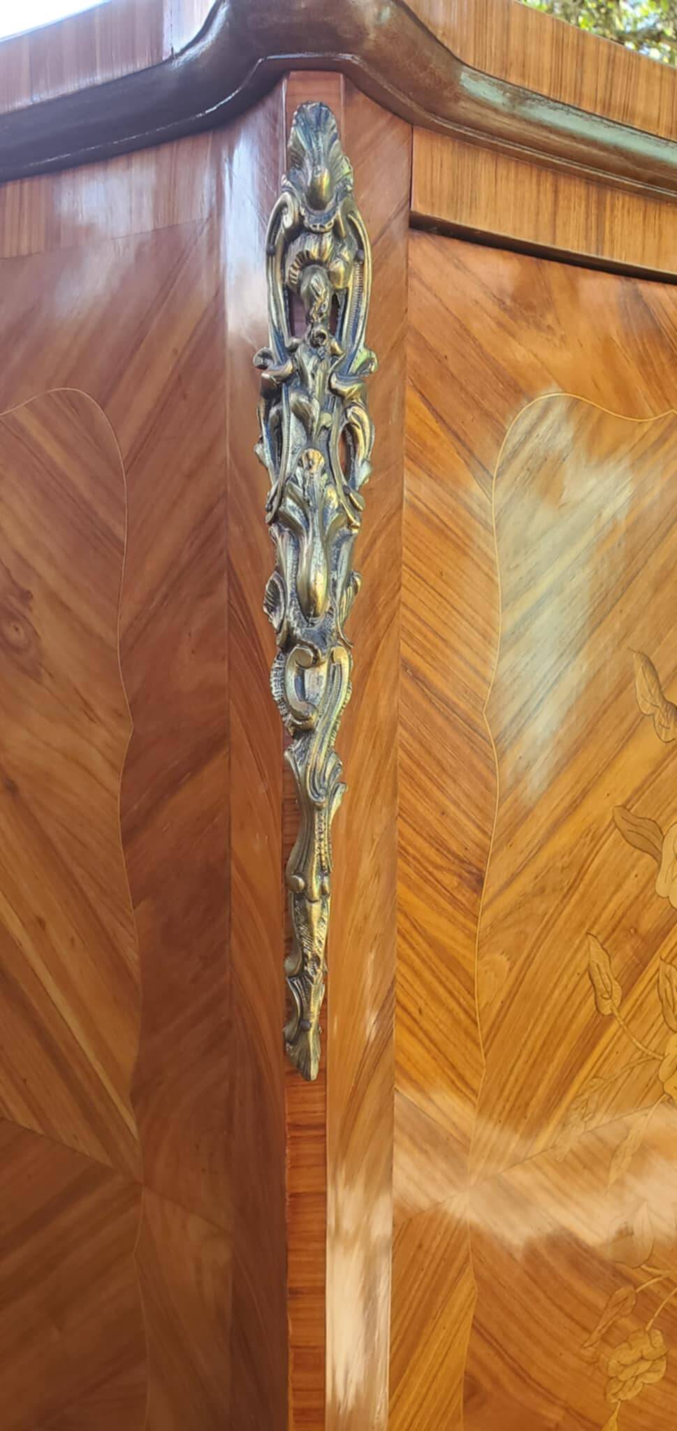 Two-door cabinet with marquetry floral design from the early 20th century.