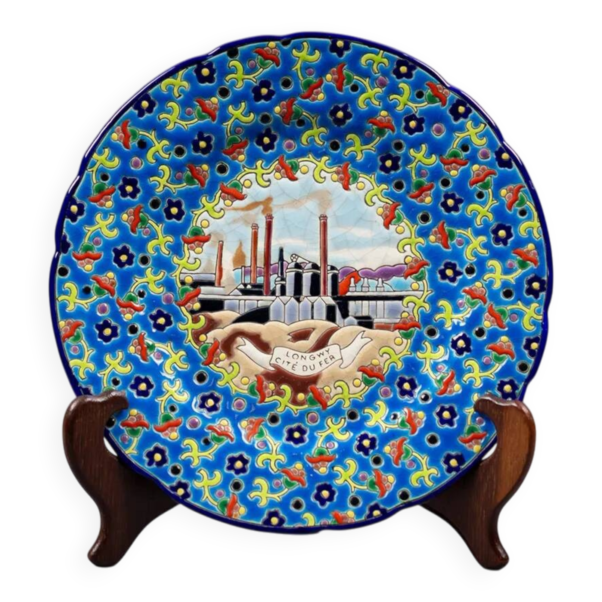 Longwy plate with polychrome enamels, decorated with the "City of Iron" motif.