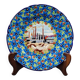 Longwy plate with polychrome enamels, decorated with the "City of Iron" motif.