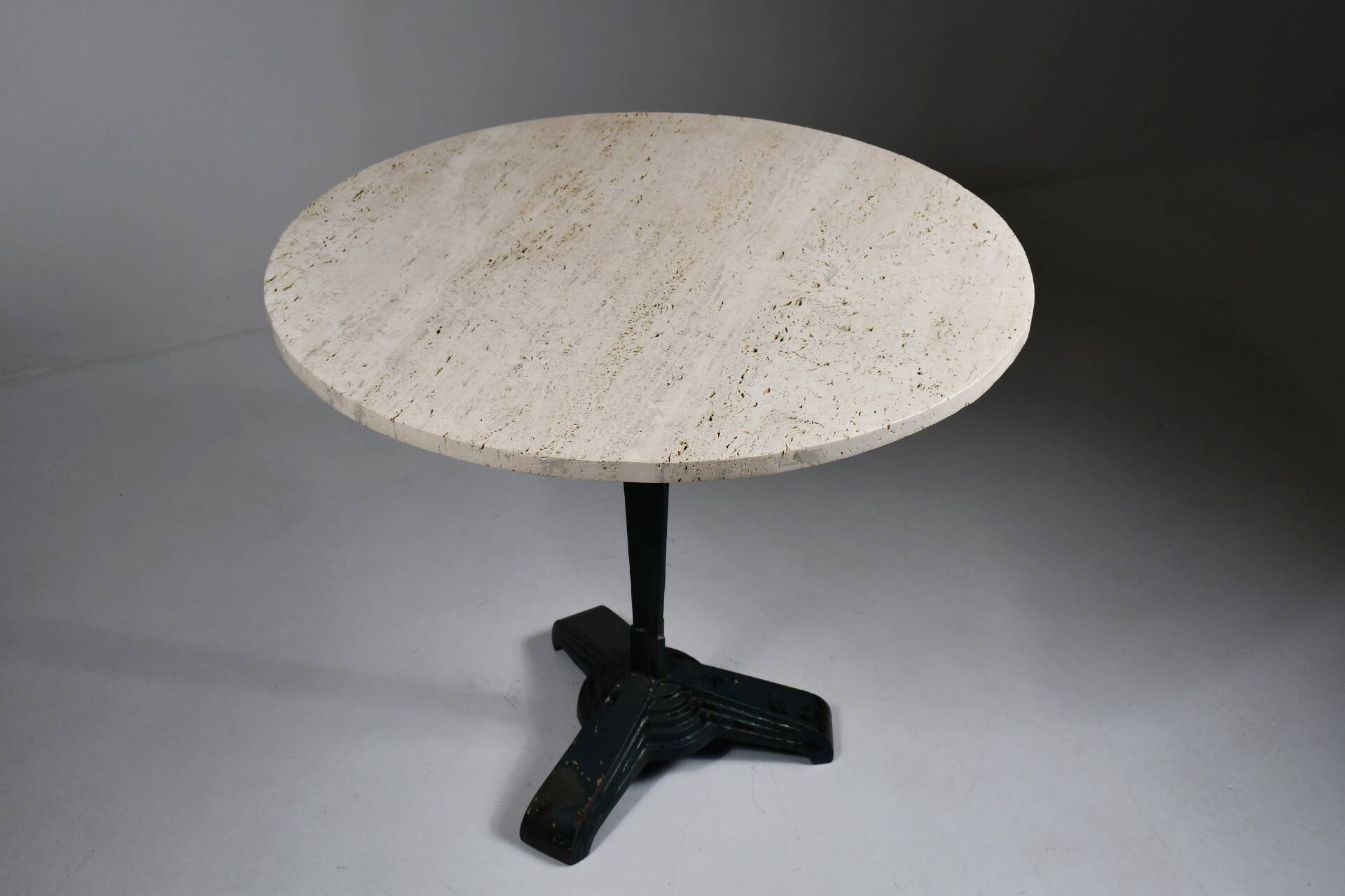 Vintage travertine bistro/dining table with metal base. (B)
