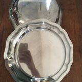 Two matching round dishes in stainless steel