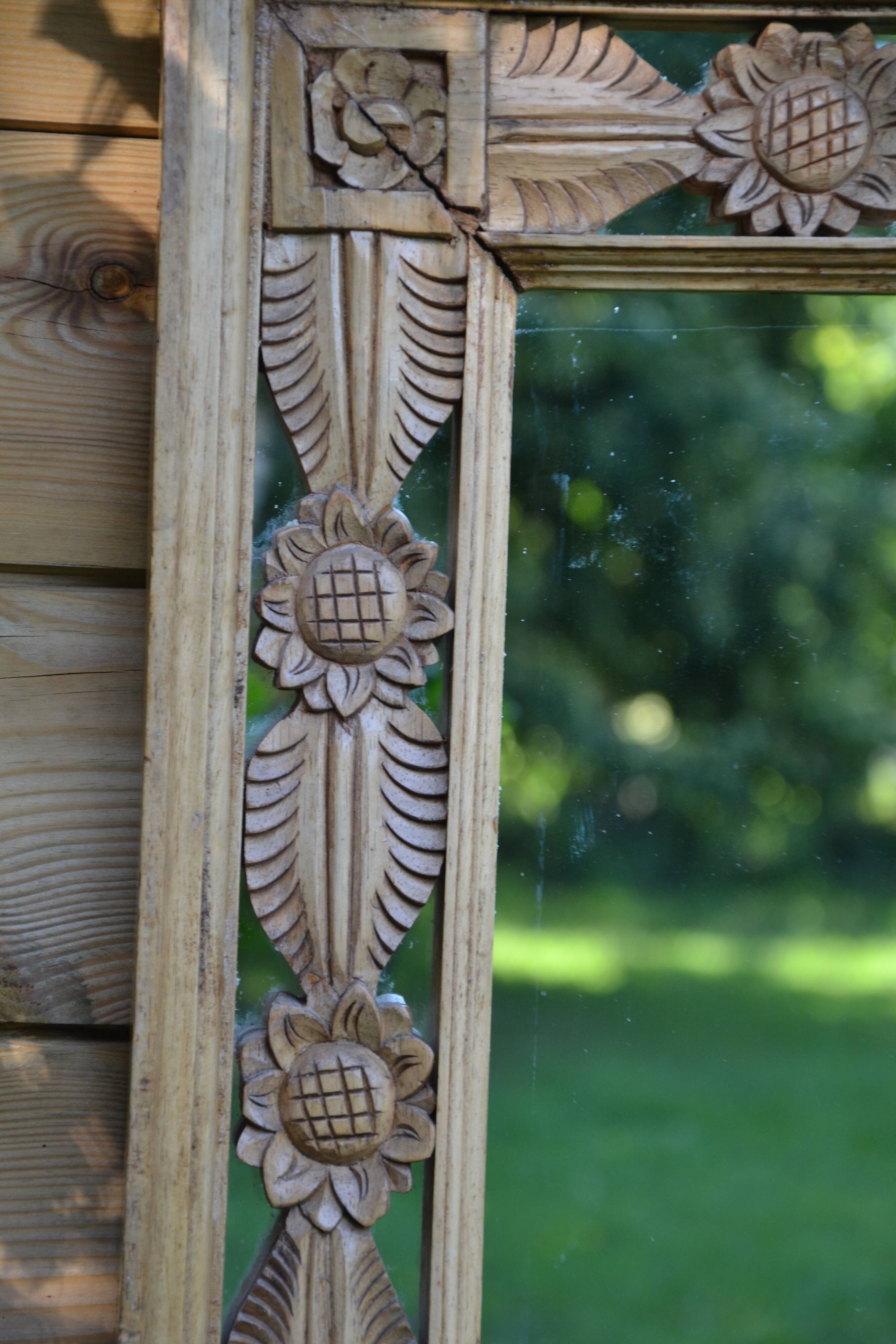Large carved wooden mirror