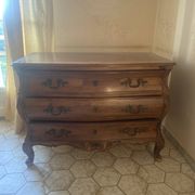 Curved commode with three drawers in light wood, Louis XV style.