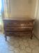 Curved commode with three drawers in light wood, Louis XV style.