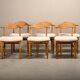 Henning Kjærnulf dining chairs set in Oak and Sheepskin, Denmark, 1960s