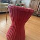 Vintage hourglass stool in red wicker or woven rattan.