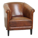 Neat, elegantly finished, cozy sheepskin club armchair with a fixed seat cushion
