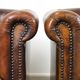 Set of two rugged sheep let of two rugged sheep leather club armchairs with a nice distressed look