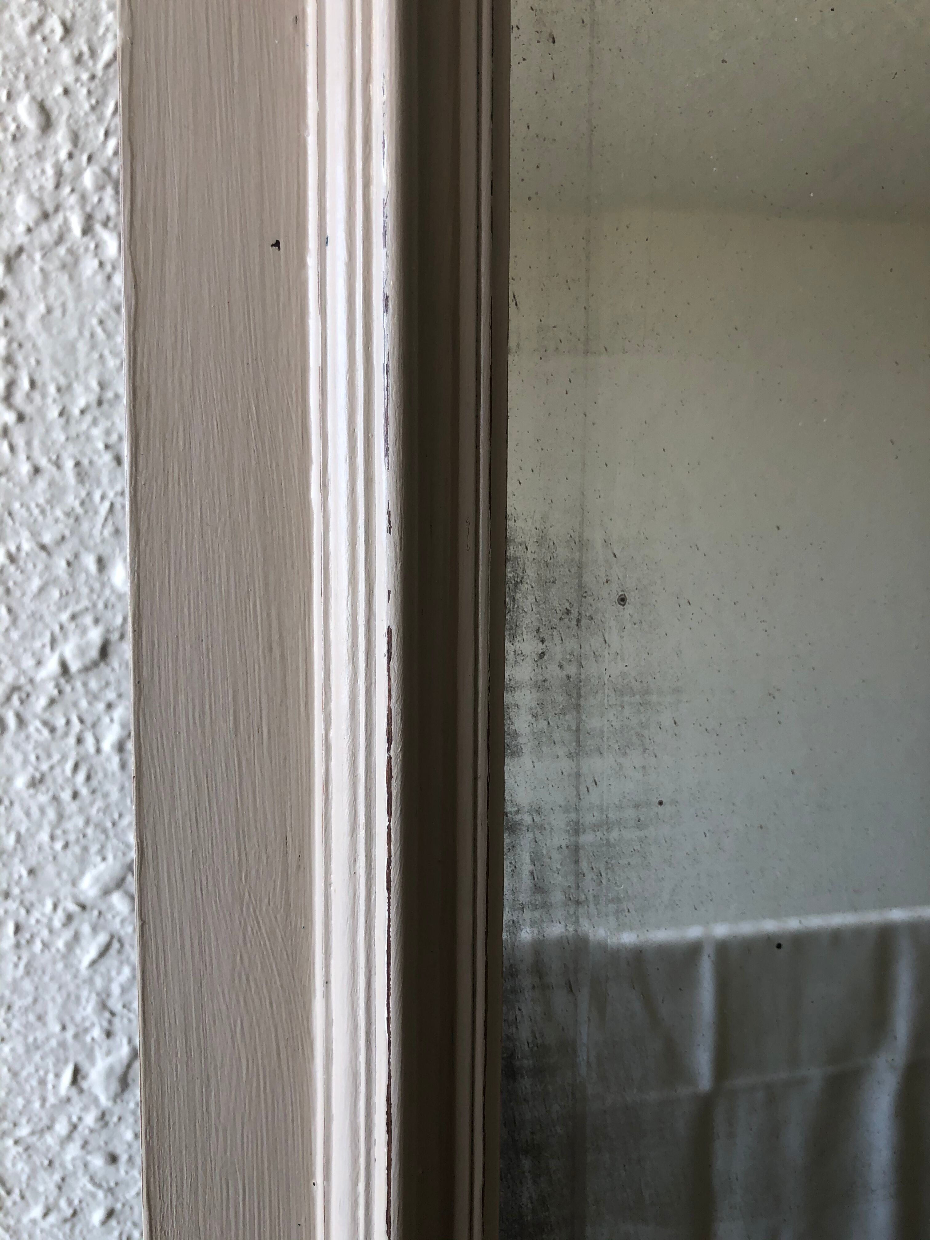 Large patinated wooden mirror with bevelled ice 73x113cm