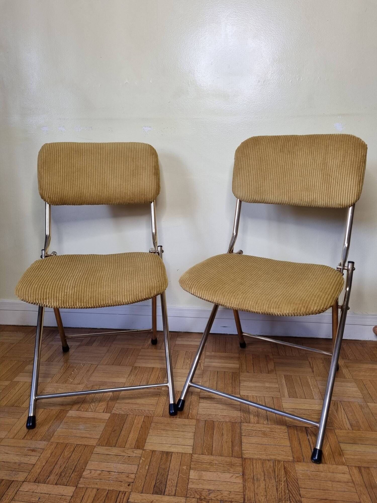 Pair of vintage folding chairs in gilded metal and 70s fabrics, restored