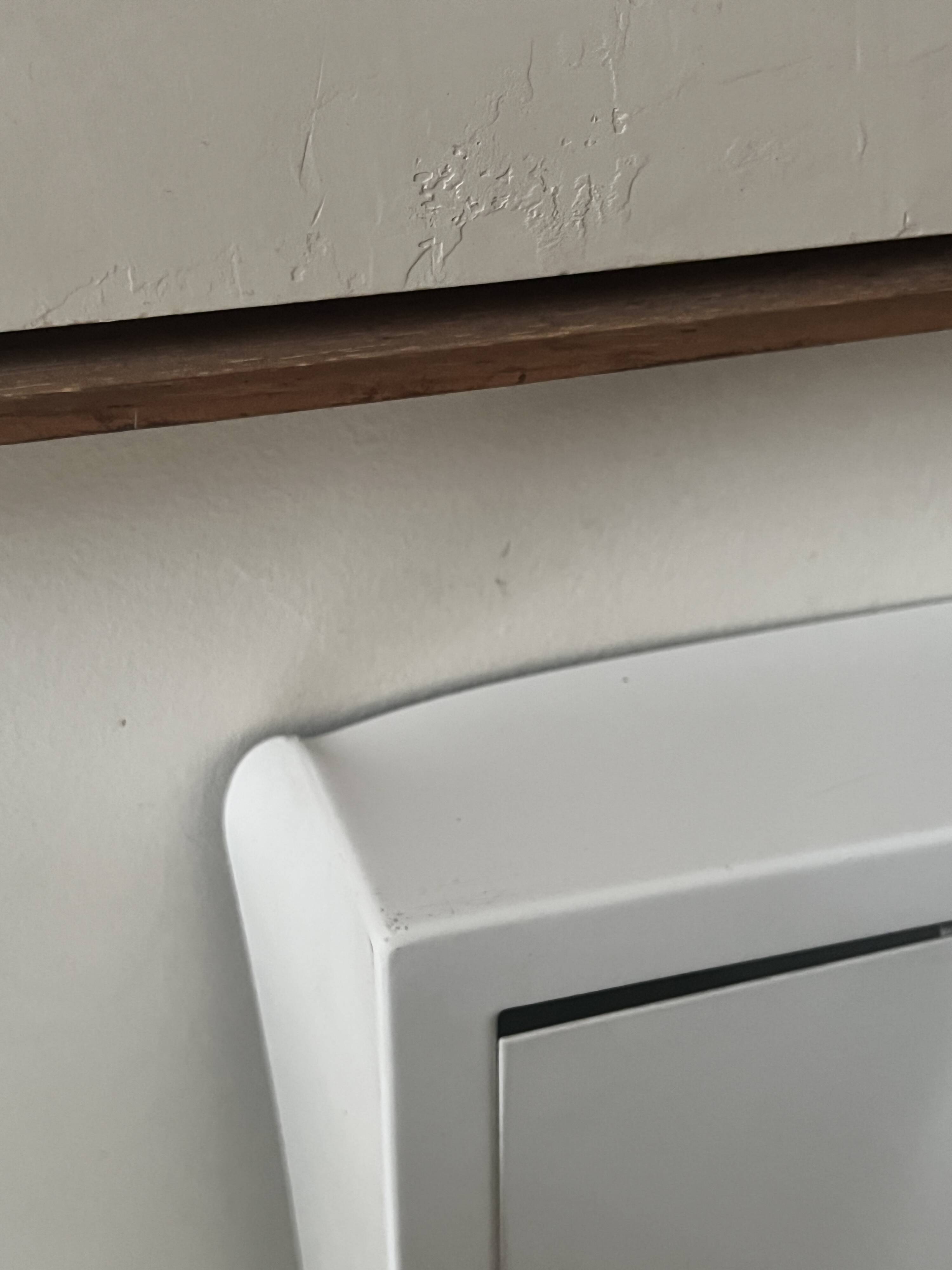 Modernist wall lamp with white metal shade, design by C. Grandidier.