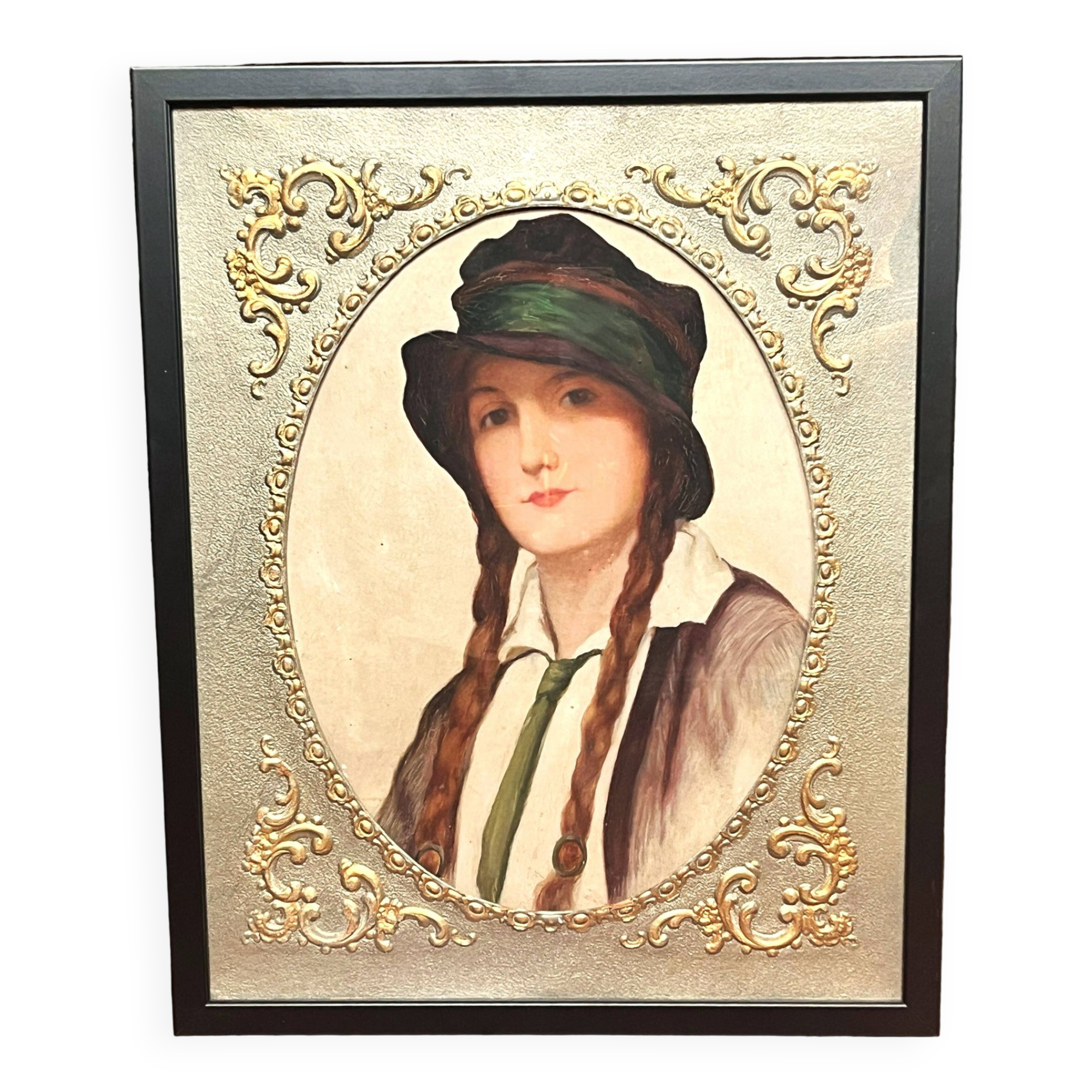 Old portrait of a young woman with braids and a hat, circa 1930