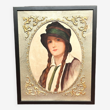 Old portrait of a young woman with braids and hat circa 1930