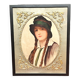 Old portrait of a young woman with braids and a hat, circa 1930