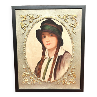 Old portrait of a young woman with braids and hat circa 1930