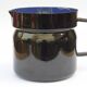 Vintage enameled sheet metal milk jug with lid for boiling milk - 1950s