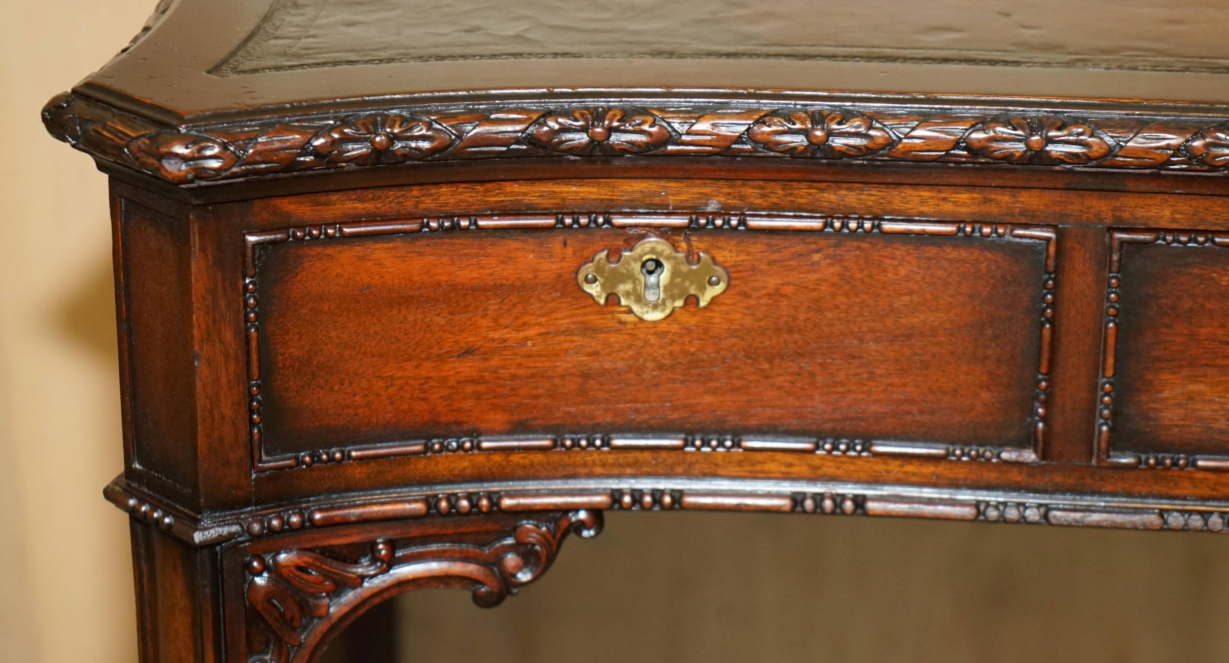 WARING & GILLOW library desk in the style of Thomas Chippendale with a leather top.