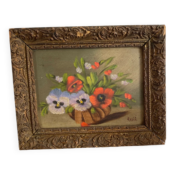 Old painting of a bouquet of pansies and poppies.