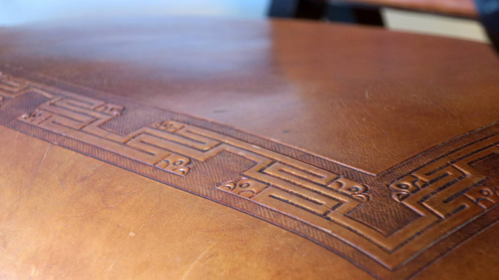 Tiahuanaco design tooled leather folding armchair by Angel Pazmino, Ecuador