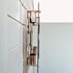 Pair of chrome metal and smoked glass wall sconces, 1970s.
