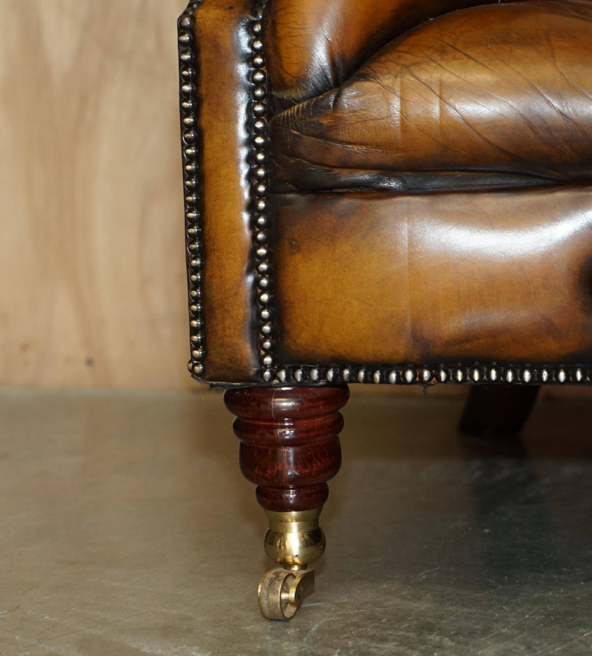 Vintage Chesterfield serpentine luxury sofa in restored leather