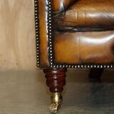 Vintage Chesterfield serpentine luxury sofa in restored leather