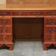 Vintage walnut desk with a leather top and two drawers.