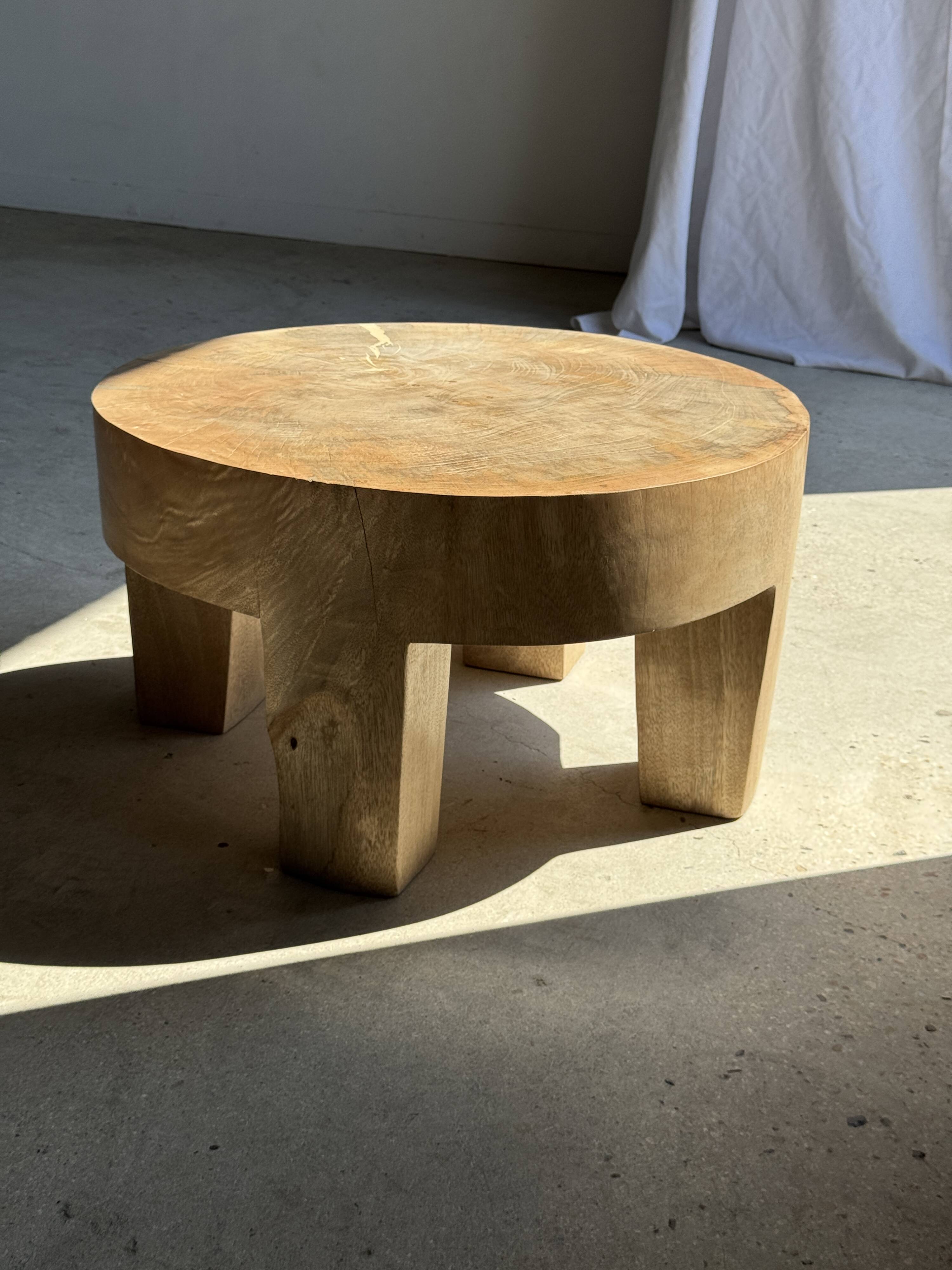 Coffee table, four-legged low table in natural solid monoxyle mango wood.