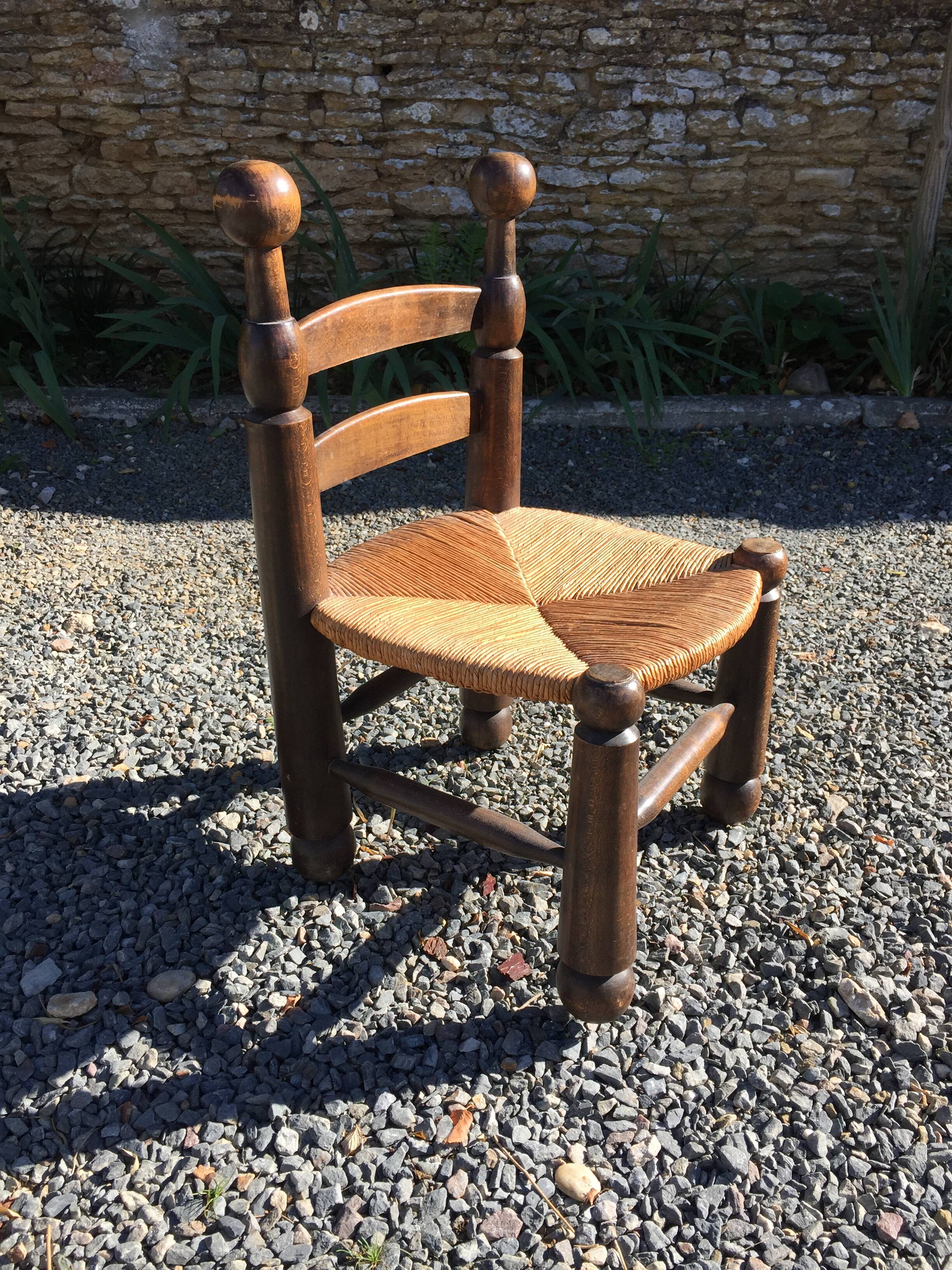 Straw low chair in the style of Charles Dudouyt