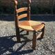 Straw low chair in the style of Charles Dudouyt