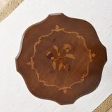 Pedestal table or side table, carved wooden legs, inlaid veneer on the top.